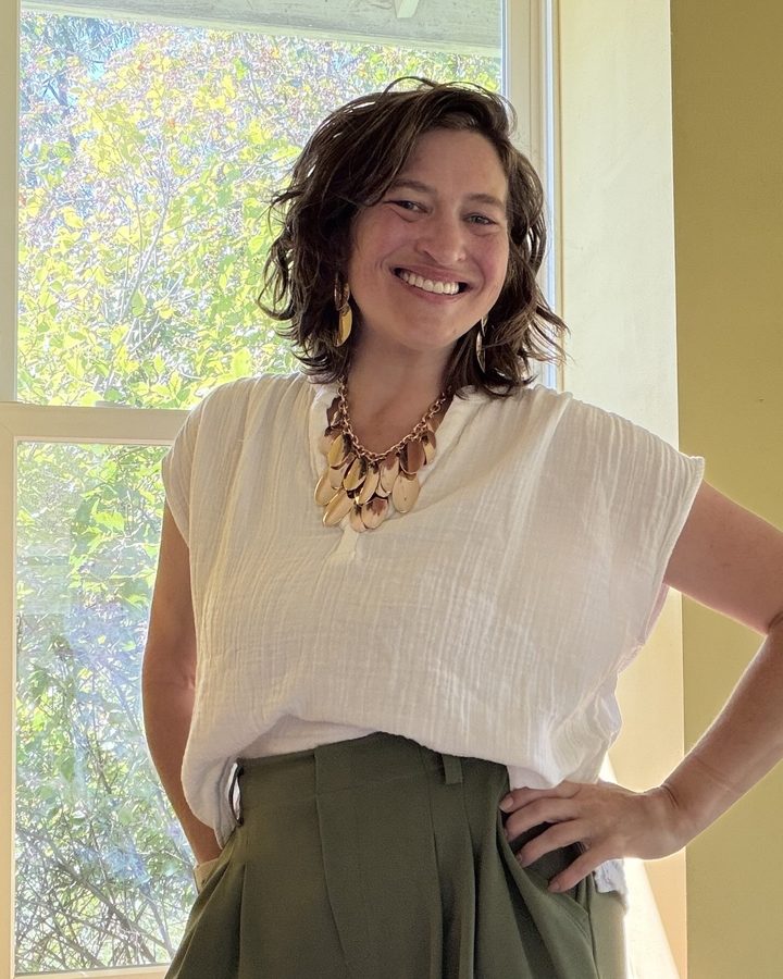 Dr. Angela Hess smiling, hands on hips